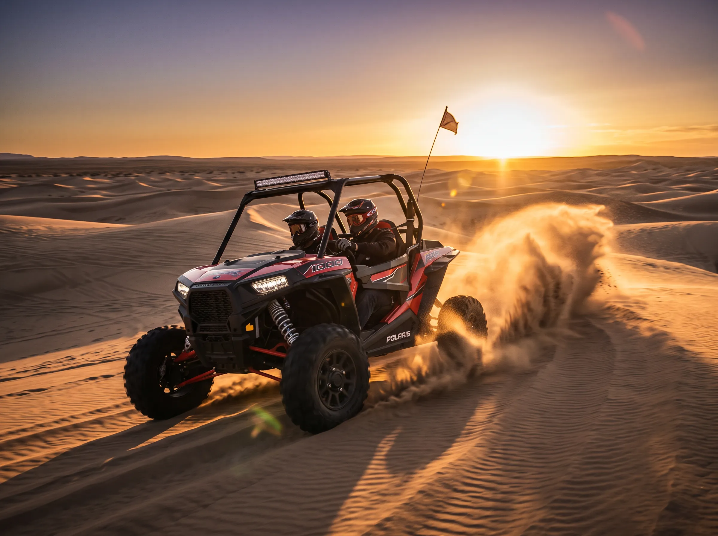 Polaris RZR 2-seater dune buggy at sunset in Dubai desert
